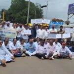 contractors march to the district collector's office against the package tender system
