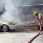 car catches fire on college road